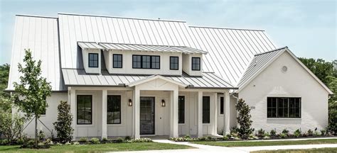 brick house with grey metal roof|white house black metal roof.